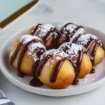 Homemade Buuelos with Warm Chocolate Sauce photo