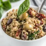 Homemade Mediterranean Quinoa Salad with Olives, Basil and Sun-dried Tomatoes photo