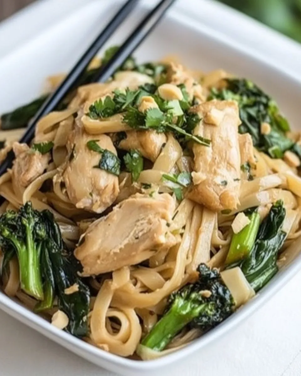Delicious Thai-Style Stir-Fried Noodles with Chicken and Broccolini shot